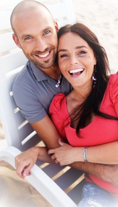 After relationship therapy online a couple reconnecting on the beach